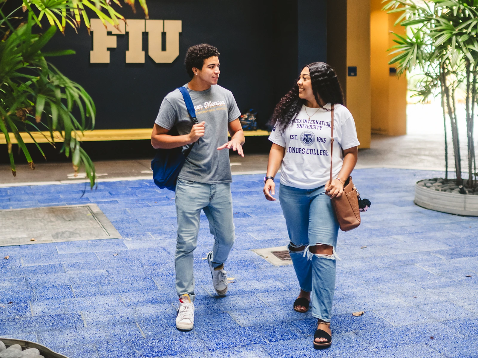 FIU students walking through the DM building