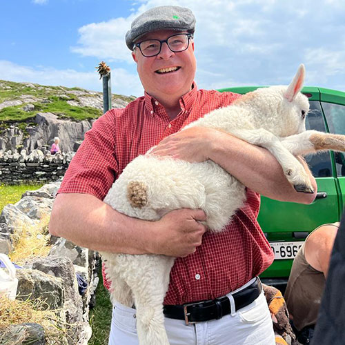 James Sutton holding a sheep