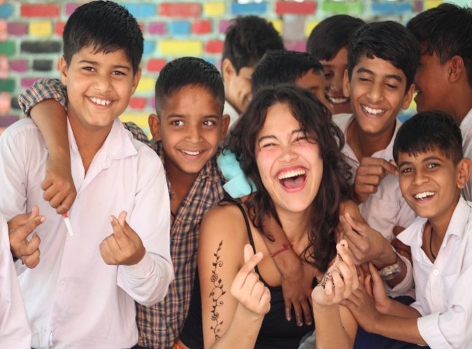 FIU Honors student Vania with children in India