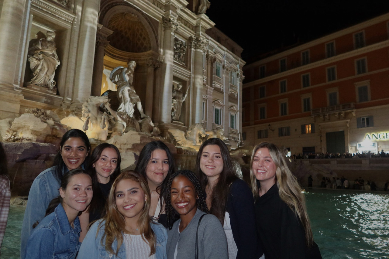 FIU Study Abroad Honors students posing in front of an Italian restaurant
